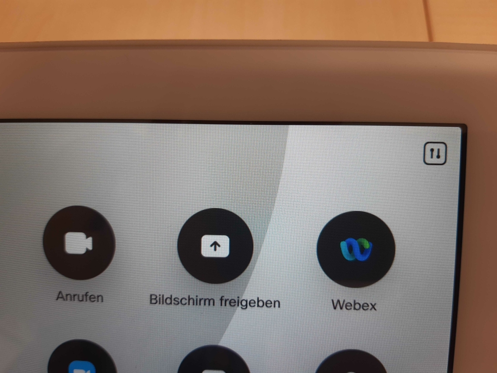icon for settings in the top right corner of the touch panel