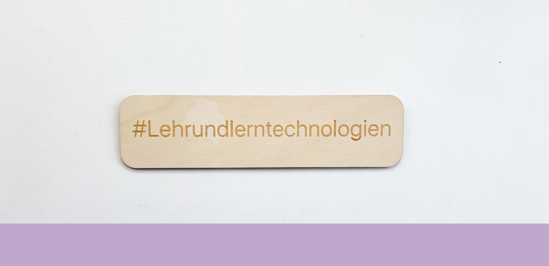 a piece of wood with #educationaltechnology engraved