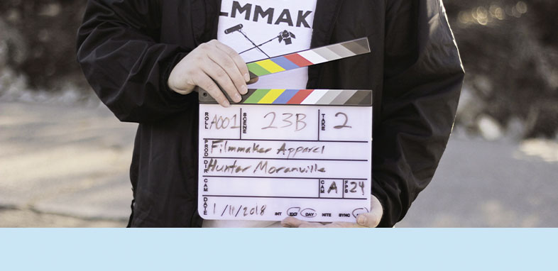 Person holding a clapperboard