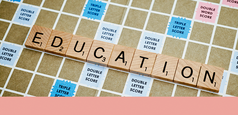 Scrabble board with the word "education"