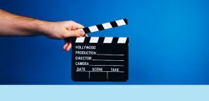 a hand holding a film slate
