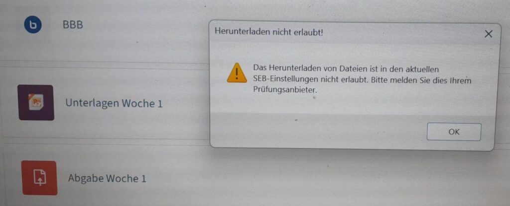 Hier sieht man ein Popup-Fenster, das den Download von Dateien aus dem TeachCenter (Exam)-Kurs ausdrücklich verbietet. Die Überschrift lautet: Herunterladen nicht erlaubt. Links neben dem Text ist ein gelbes Fragezeichen-Icon